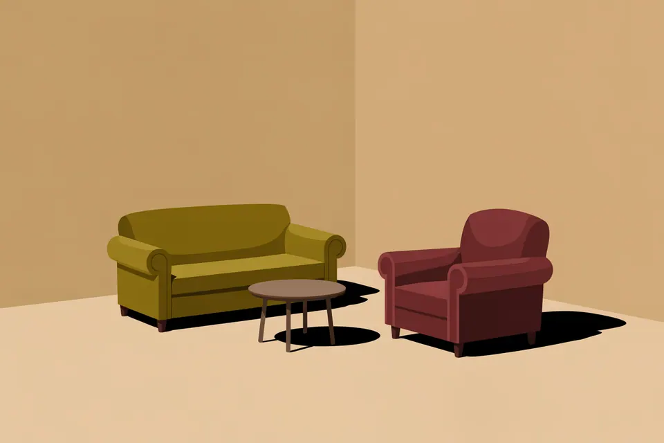 An olive sofa and a burgundy armchair with a small round table between them.